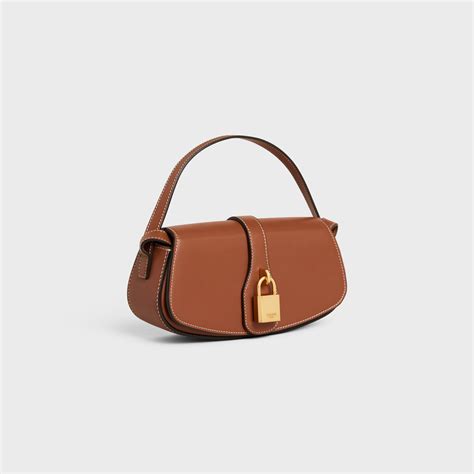 clutch on strap celine|CELINE Smooth Calfskin Tabou Clutch on Strap Tan.